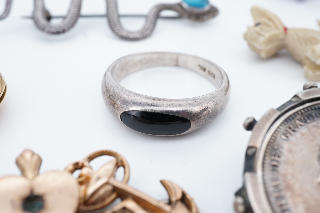 A small group of sterling, white metal and and other jewellery, including a charm bracelet, frog brooch, etc.